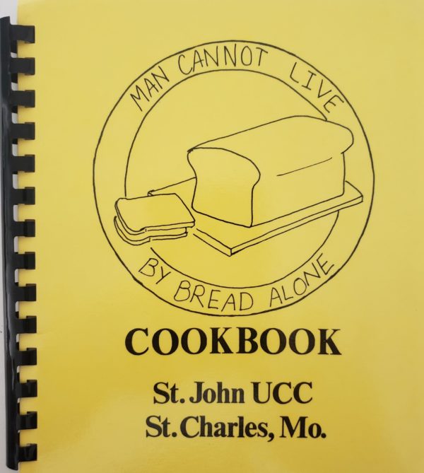 Man Cannot Live By Bread Alone Cookbook (Plastic-comb Paperback)